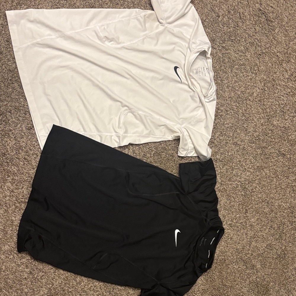 Nike Pro BoysBlack and White Dri Fit short sleeve tops.  Size medium